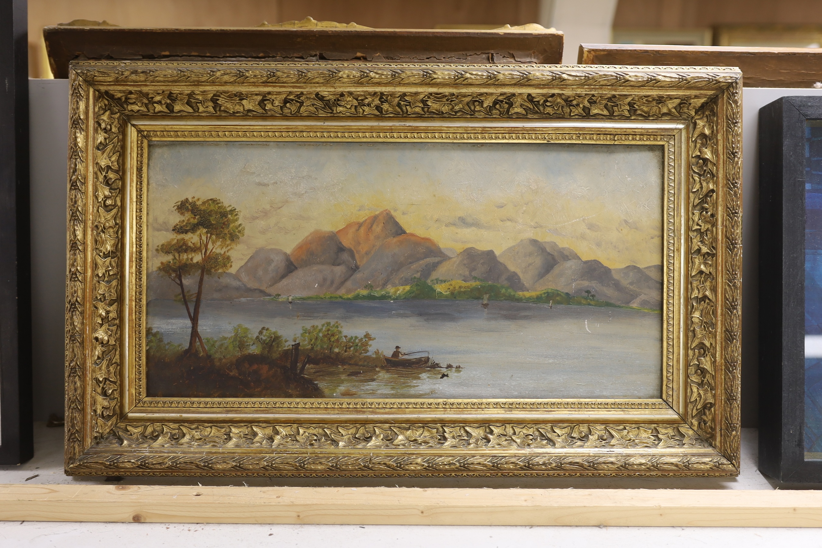 English School circa 1900, oil on board, Angler upon a loch, 23 x 45cm